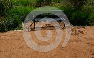 Sand wheeling. garden wheelbarrow carries a worker and pours on piles of beige gravel to repair park, forest, dirt road. erosion c