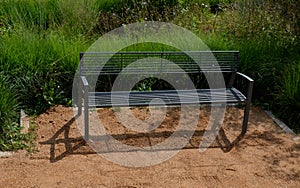 Sand wheeling. garden wheelbarrow carries a worker and pours on piles of beige gravel to repair park, forest, dirt road. erosion c