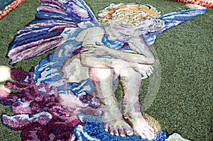 Sand work showing an angel with butterfly wings