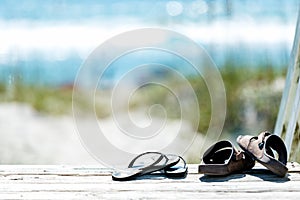 Sandals taken off and left on boardwalk