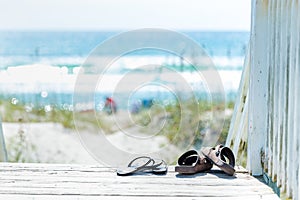 Sandals taken off and left on boardwalk