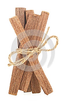 Sandalwood sticks tied with rope isolated on white background