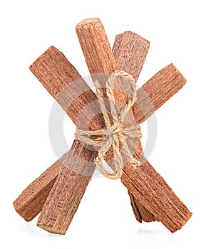 Sandalwood sticks tied with rope isolated on white background