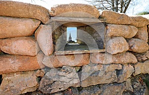 Sandbags of a trench to protect army soldiers and the narrow loophole from which the ossuary of Mount Cimone photo