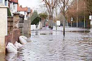 Sandbags Outside House On Flooded Road