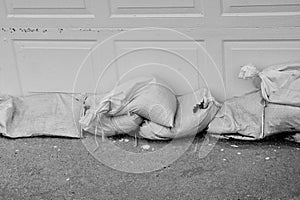 Sandbags Stacked Against a Garage Door to Prevent Flooding