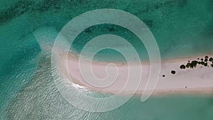 Sandbank at the tropical island in Maldives. Aerial video. Drone footage