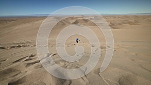 Sandboarder at Great Sand Dunes National Park, Colorado, USA