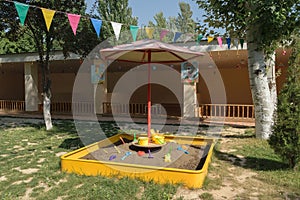 Sandbox in a kindergarten with toys for playing in the sand