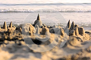 Sandcastle with the sea in the background