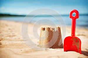 Sandcastle on the sea in summertime photo
