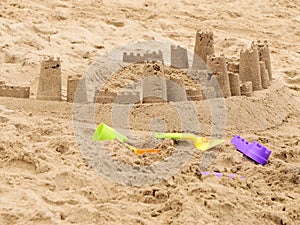 Sandcastle on sunny day during family vacation