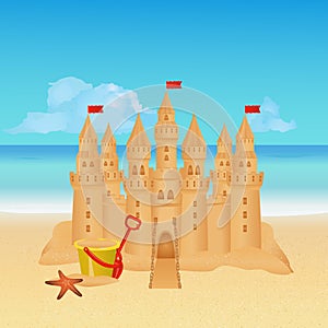 Sandcastle on tropical beach. Summer background.