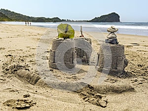 Sandcastles on the beach during an overcast day