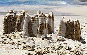 Sandcastles on the beach,vacation concept, toned