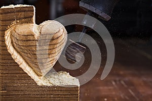 Sanding wood heart close