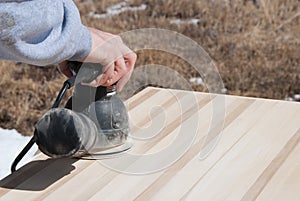 Sanding Wooden Table