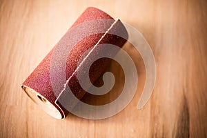 Sandpaper roll on a wooden table