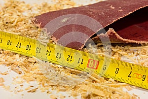 Sandpaper, ruler and sawdust photo