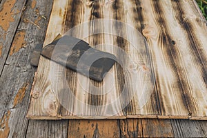 Sandpaper on a wooden table/sandpaper on a wooden table. Wood processing