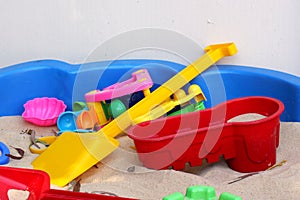Sandpit with colorful toys photo