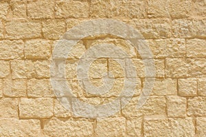 Sandstone brick wall background.