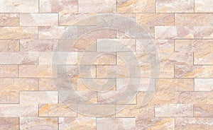 Sandstone brick wall patterned (natural patterns) texture background.