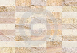 Sandstone brick wall patterned (natural patterns) texture background.