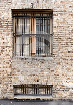 Sandstone brick wall with two windows