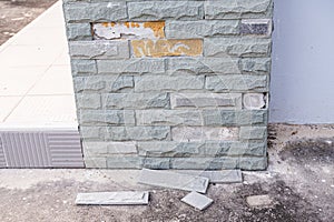 Sandstone brick walls that are peel off because of long time and not work standard construction