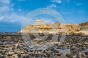 Sandstone butte of Salt Pans, Xwejni Bay, Xwejni, Gozo Island, Malta