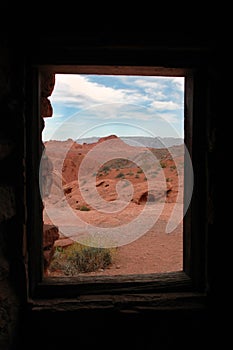Sandstone Cabin Window to Desert Landscape
