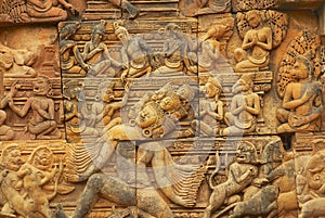 Sandstone carving at the wall of the ancient Banteay Srei Temple ruin in Siem Reap, Cambodia.