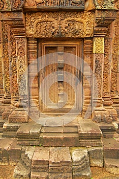 Sandstone carving at the wall of the ancient Banteay Srei Temple ruin in Siem Reap, Cambodia.