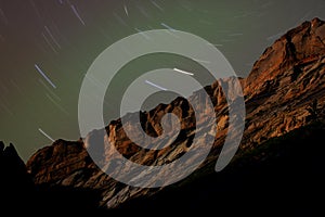 Sandstone Cliffs at Night with Star Trails photo