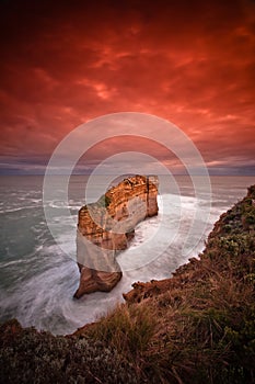 Sandstone pillers sunrise from water at 12 apostle