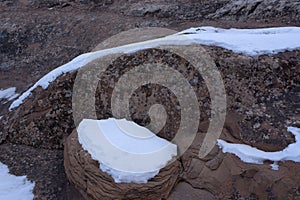 Sandstone Redrock with Lichen Patterns and Snow Patches