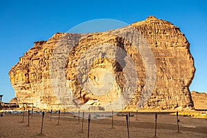 Sandstone rock erosion monolith standing in the desert, Al Ula, Saudi Arabia photo