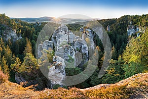 Sandstone rocks at the Europe landscape in summer season. Beautiful sunset, sandstone towers. Climbing on the sandstone rock.