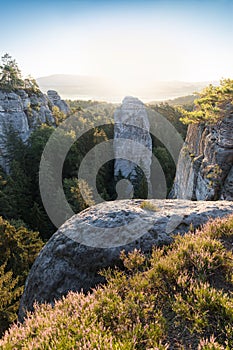 Sandstone rocks at the Europe landscape in summer season. Beautiful sunset, sandstone towers. Climbing on the sandstone rock.