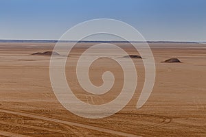 Sandstone rocks on the horizon of the Sahara desert of Tunisia