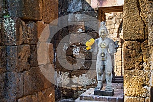 Sandstone statue of god Khmer Art at ancient thai castle or Prasat Muang Singh in Kanjanaburi , Thailand