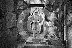 Sandstone statue of god Khmer Art at ancient thai castle or Prasat Muang Singh in Kanjanaburi , Thailand