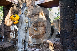 Sandstone statue of god Khmer Art at ancient thai castle or Prasat Muang Singh in Kanjanaburi , Thailand