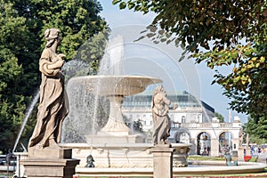 Sandstone statues and fountain in the Saxon Garden, Warsaw, Poland. Made before 1745 by anonymous Warsaw sculptor under the direct photo