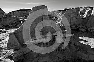 Sandstone wall sections create corridors along the Bisti Badlands pathways