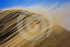 Sandstorm on dune photo