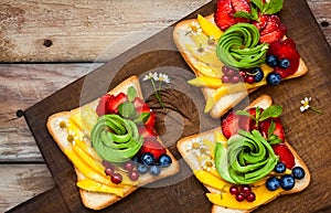Sandwich with avocado,fruits and berries