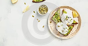 Sandwich with avocado and poached egg. Healthy food concept. banner, menu recipe place for text, top view