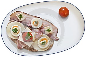 Sandwich With Bacon Rashers Egg Cheese Ham And Cherry Tomatos Served On Porcelain Platter Isolated On White Background